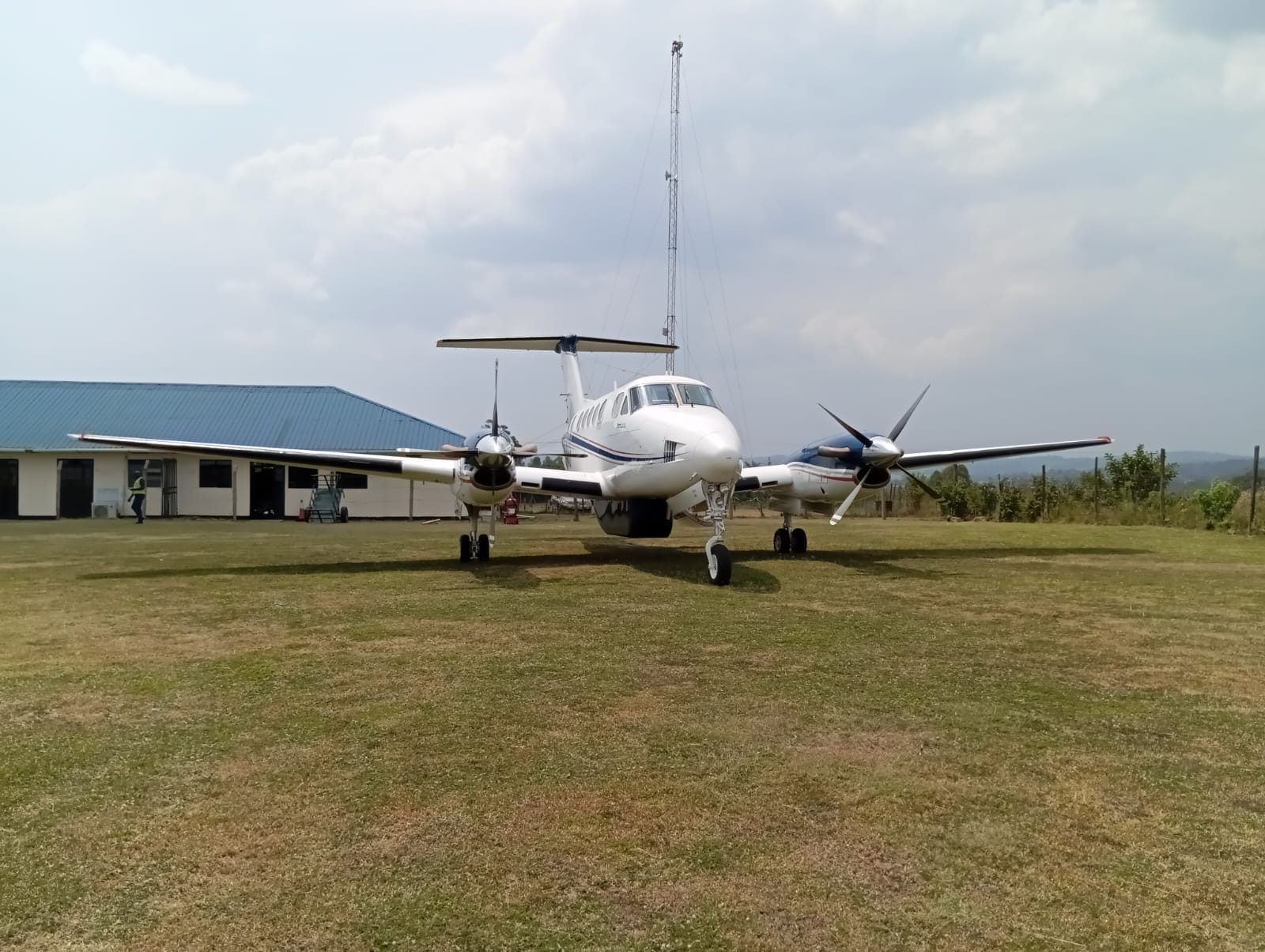 Westwind Aviation aircraft parked on a remote grass airstrip